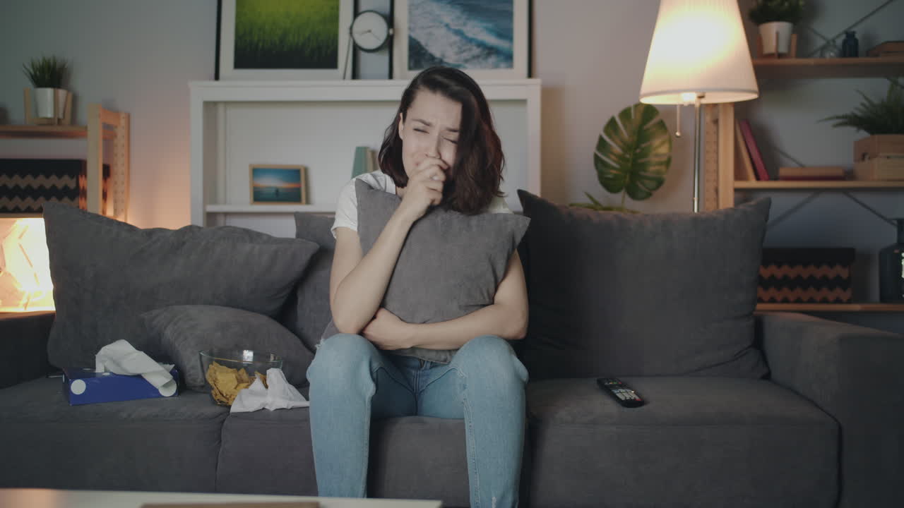 Woman Crying While Watching a Sad Movie at Home