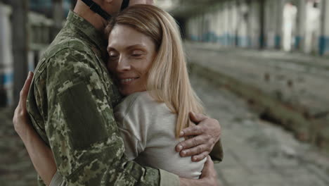 soldier and wife embrace