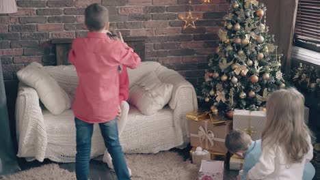 sons-daughter-open-present-boxes-and-show-gifts-to-mother