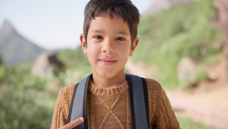 smile, face and boy on a hike with backpack