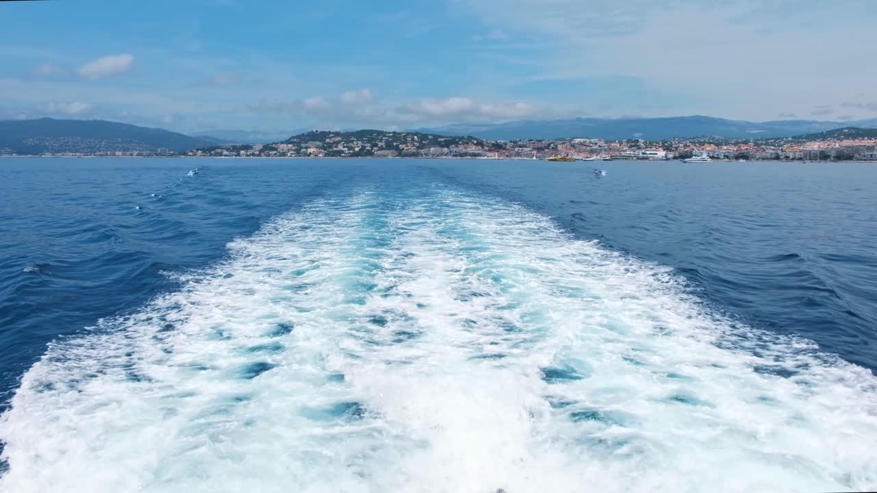 General view of Bay of Cannes and the coastline from a boat, France