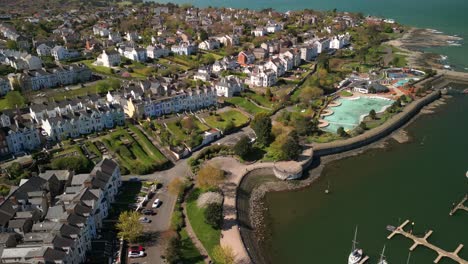 Overhead-shot,-beginning-on-the-left-hand-side-and-moving-to-the-right-to-reveal-boats-on-a-marina-on-a-sunny-day