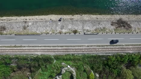 aerial view of road, river, and train tracks