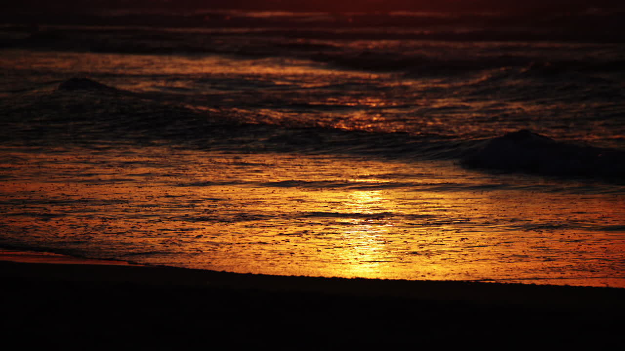 Vibrant Santa Cruz sunset with stunning ocean views, golden skies, and rolling waves—ideal for cinematic scenes, travel videos, or peaceful nature backgrounds.