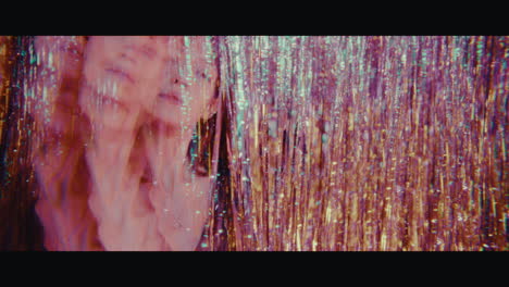 woman in a neon glittery tunnel