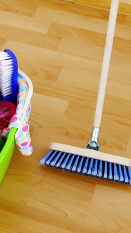 various housekeeping supplies in a bucket