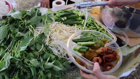 assembling ingredients for traditional thai soup.