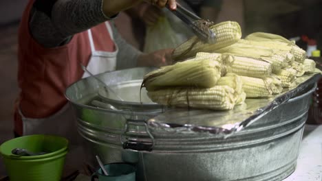 person selling sweet corn in the streets of guanajuati