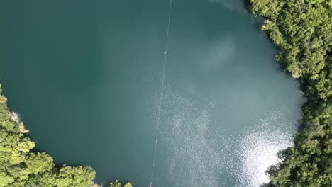 cenote aerial view of bacalar lagoon of seven colours mexico