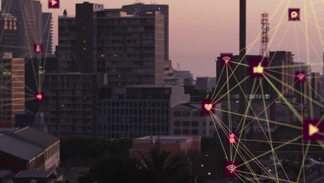 animación de dos globos de iconos digitales girando contra una vista aérea del paisaje urbano
