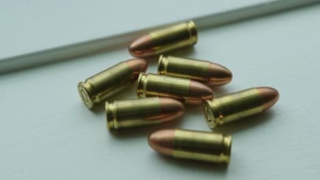 close up pan right of 9mm handgun bullets