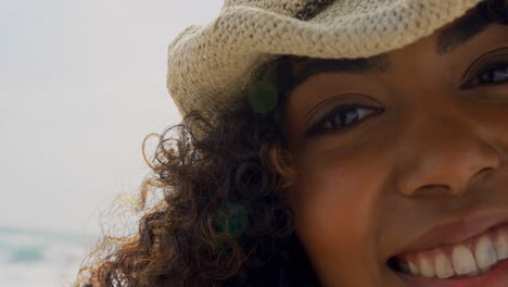 Close-up-of-African-american-woman-standing-on-the-beach-4k