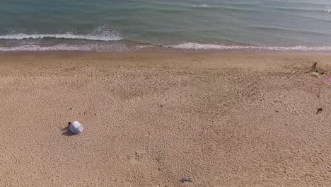 aerial view of the beach paralell to the sea