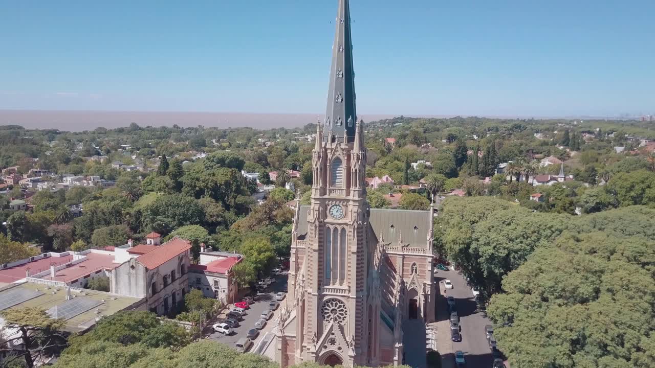 aerial view of the cathedral surrounded by green trees and the river in the background - Buenos Aires - San Isidro