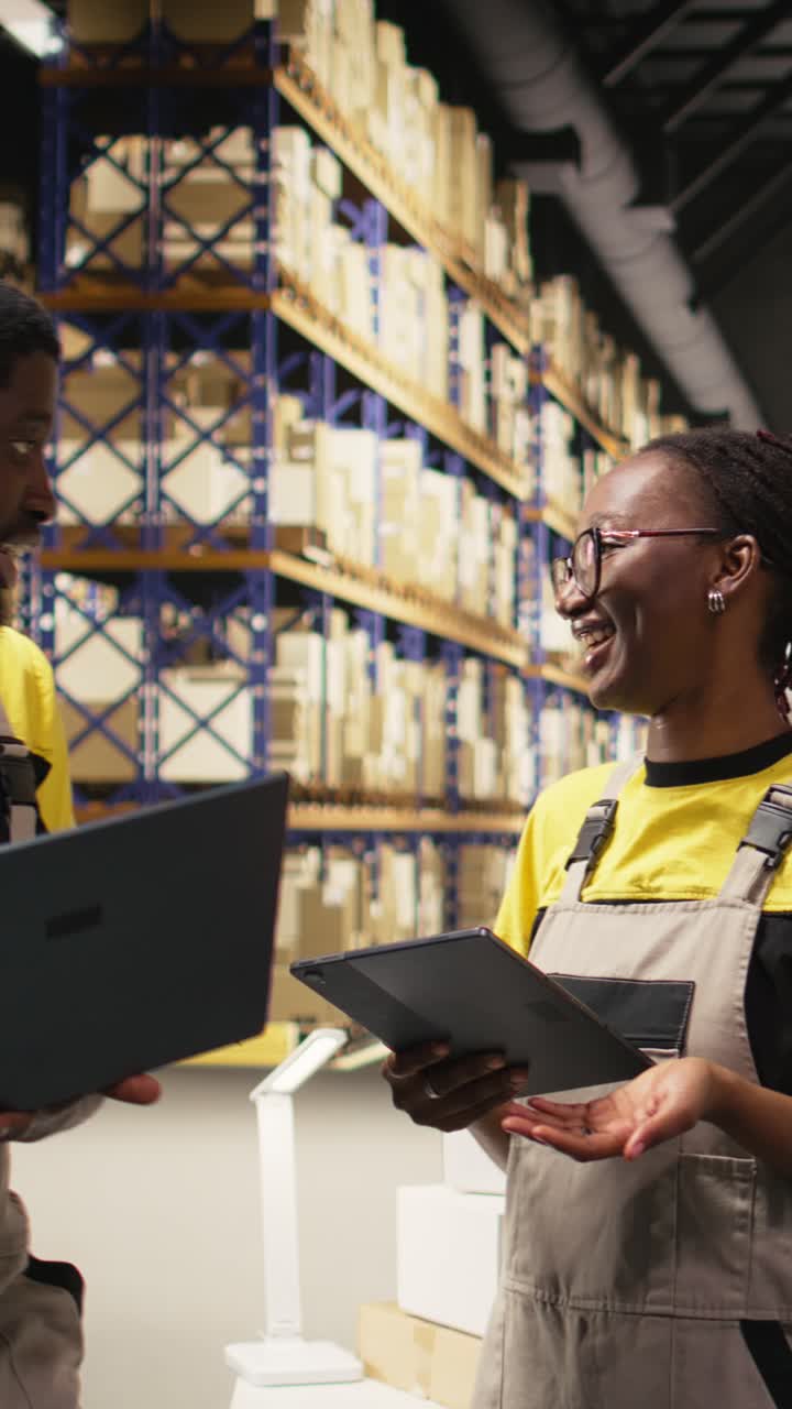Vertical Video African american staff checking inventory and shipment details