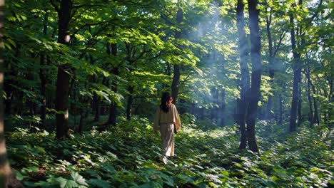 woman hiking in a lush forest