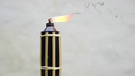 liquid fuel bamboo torch burning