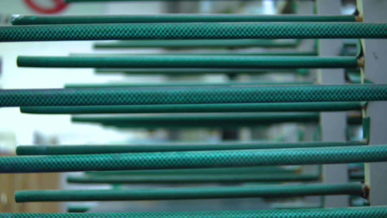 Side View Of Glass Panes Resting On Shelves On Factory Floor. Pedestal Up