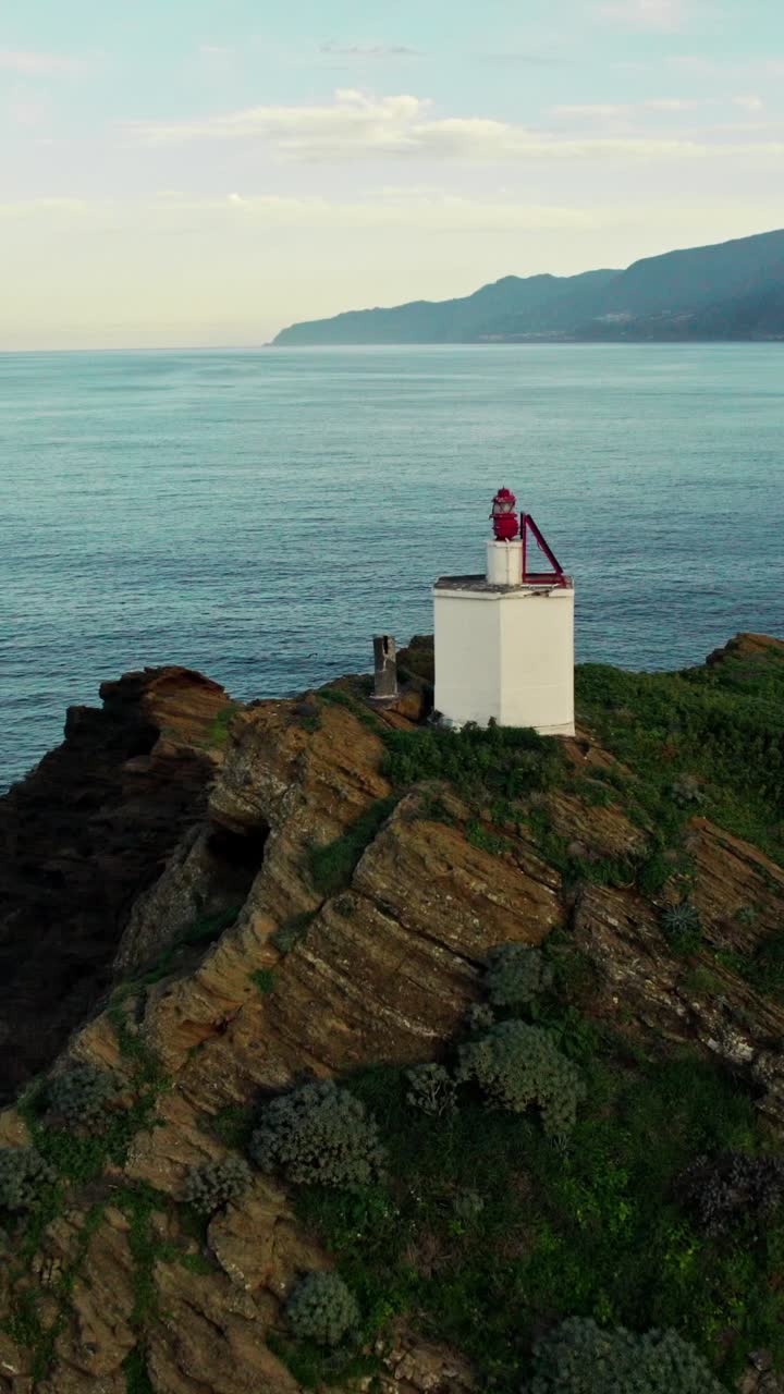 Coastal Lighthouse on a Rocky Cliff