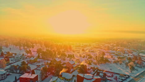 blinding sunlight and vibrant colors into yellow sky over snowy landscape