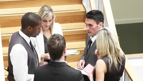 business people discussing in corridor footage