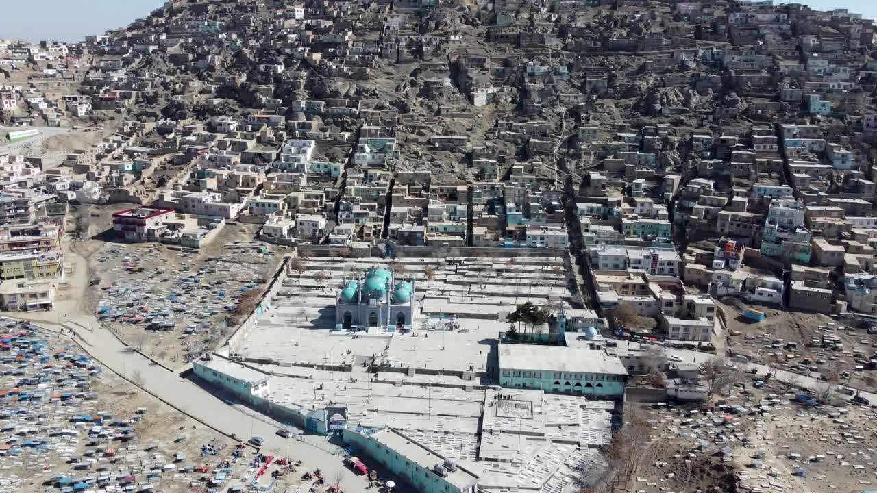 Kabul, Afghanistan. Drone Shot of Sakhi Shrine Blue Mosque, Cemetery and Hillside Homes