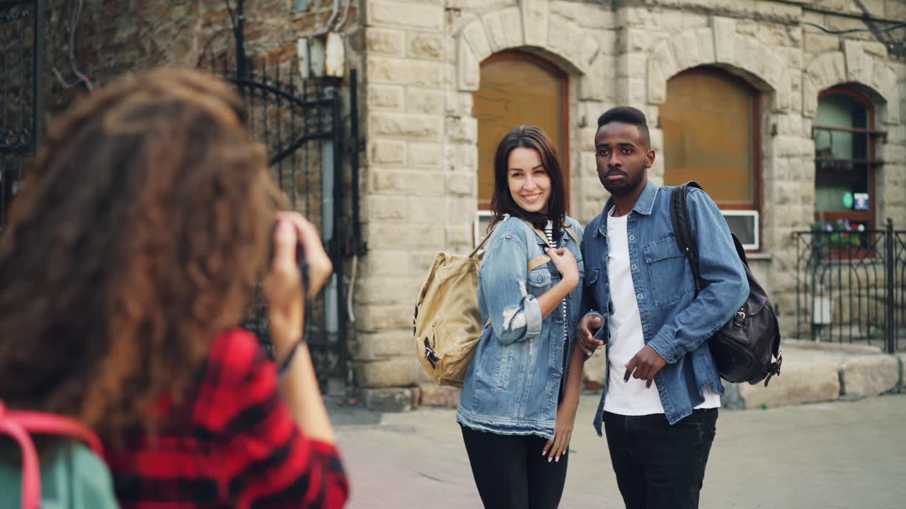 Friends taking a photo on a city street