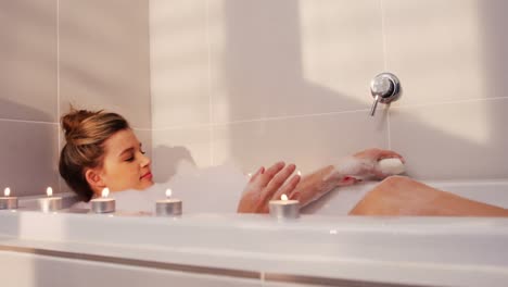 woman taking bath in bathtub