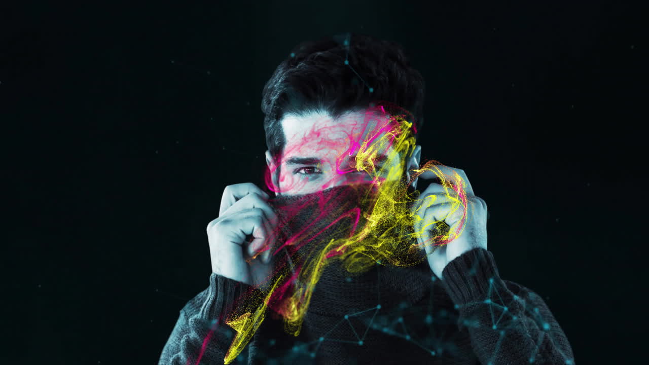 Man adjusting scarf with colorful abstract animation overlay on dark background