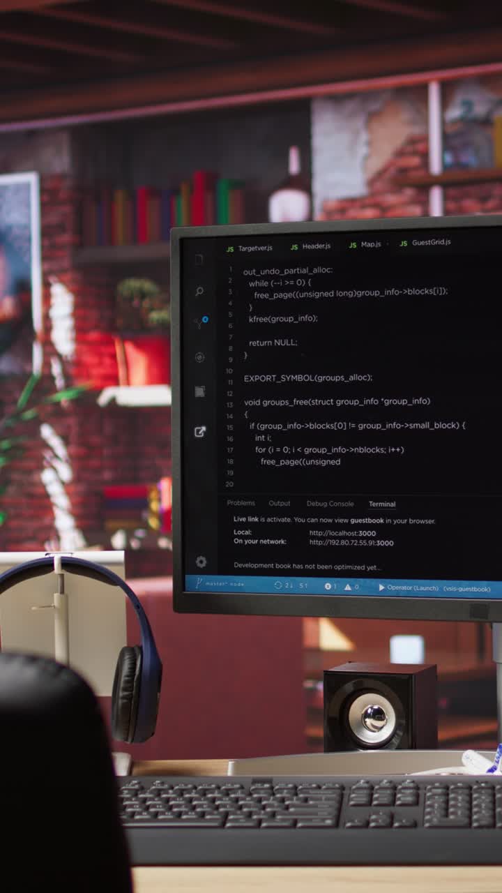 Vertical video Coding interface shown on computer screen on desk