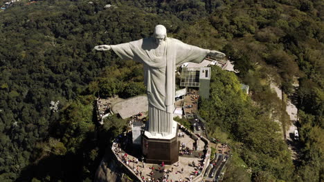 flying down christ the redeemer statue on the corcovado hill in rio de janeiro