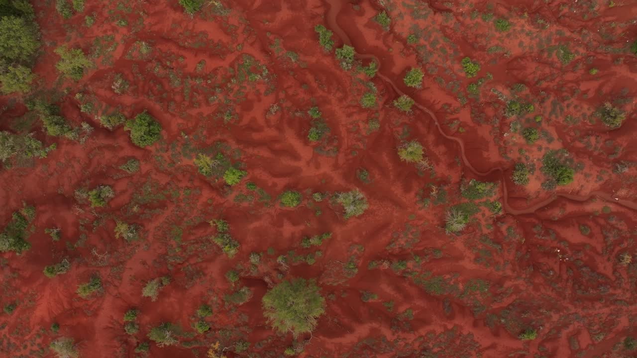 Winding path tracing colorful red terrain Kokkinopilos Greece