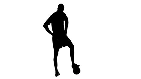 Video-of-black-silhouette-of-male-soccer-player-with-ball-isolated-on-white-background