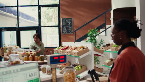regular client looking at produce and bulk items in eco store