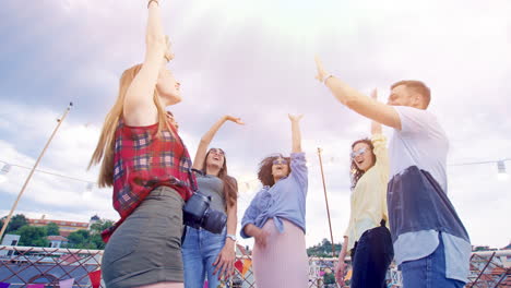 friends celebrate rooftop party with