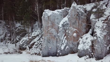 snowy rock formations in a forest