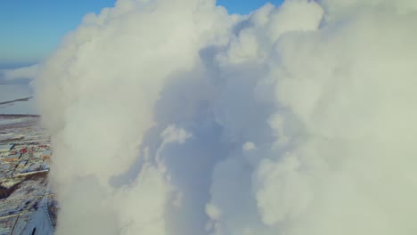 industrial plant smoke stack in winter