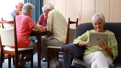 senior woman using digital tablet