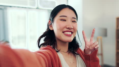 Face,-woman-and-peace-for-selfie-in-home