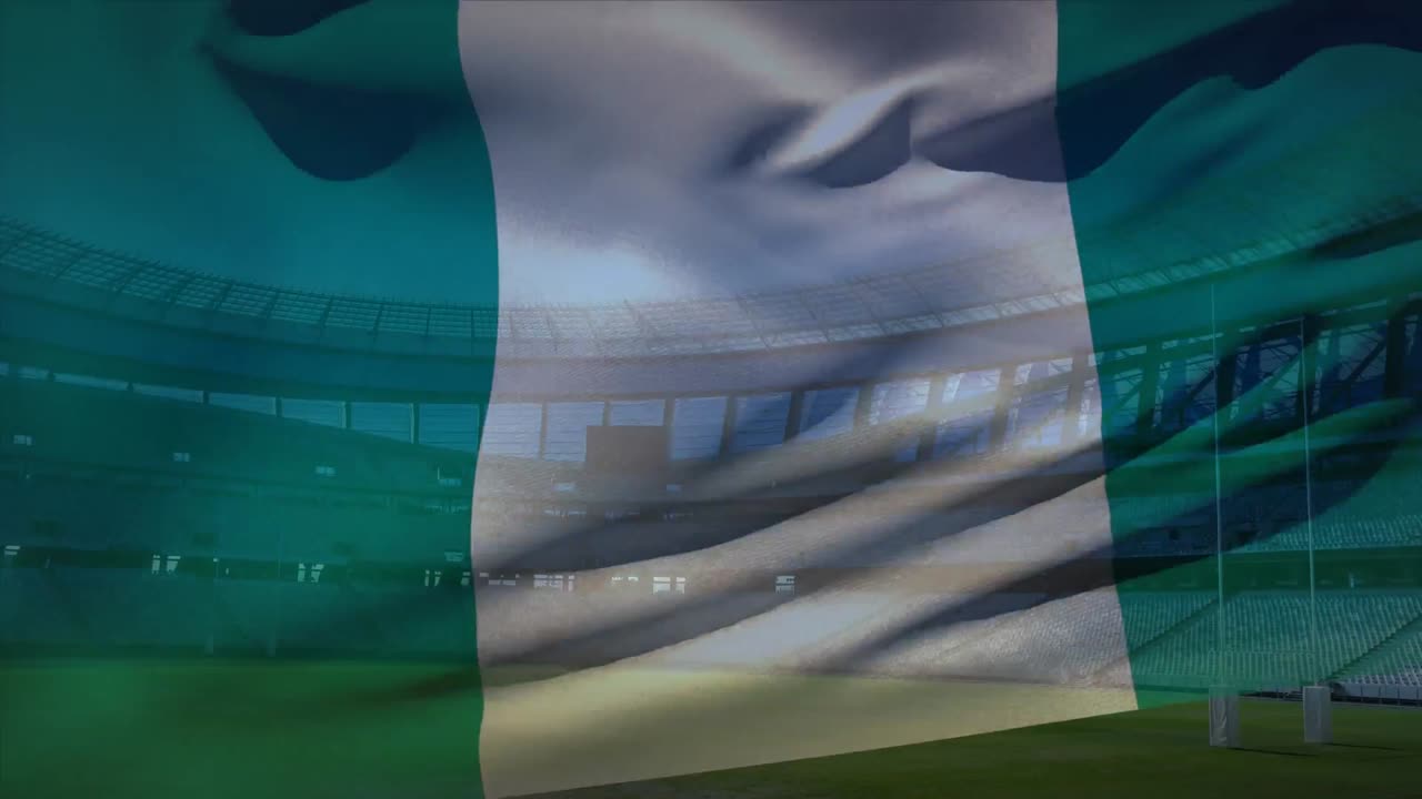 bandera ondeando frente a un estadio