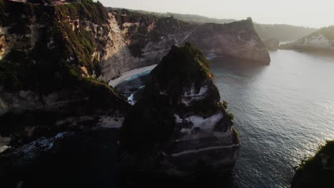 Towering-Limestone-Cliff-In-Ocean-At-Sunrise-Near-Diamond-Beach