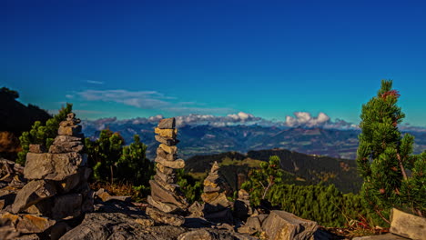 Rocks-formation-art-and-Alps-in-background,-time-lapse