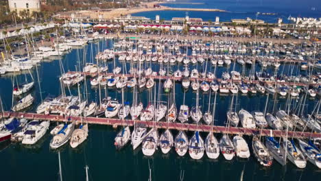 aerial shot of boats in harbor in barcelona, spain