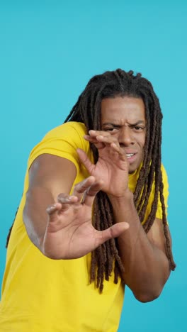 Man with dreadlocks expressing fear