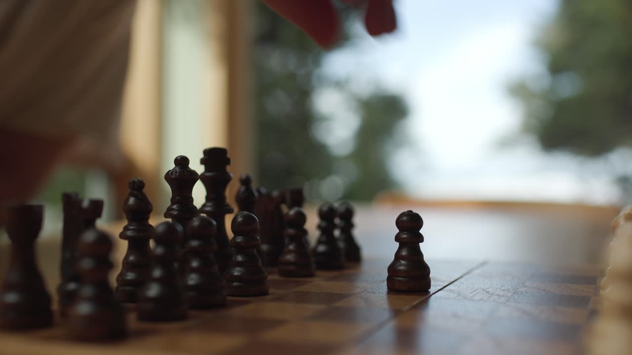 Man Playing Chess, Moving A Pawn - Close Up