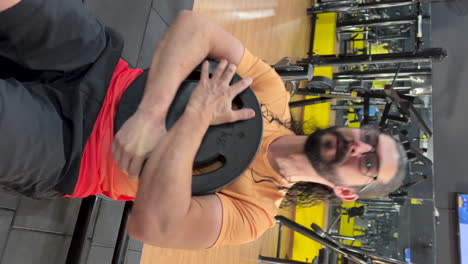 latin man performing abdominal exercises on an incline bench