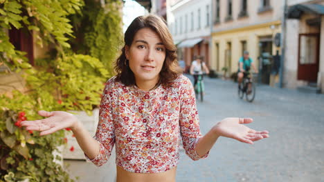 confused woman feeling embarrassed about ambiguous question, having doubts, no idea in city street