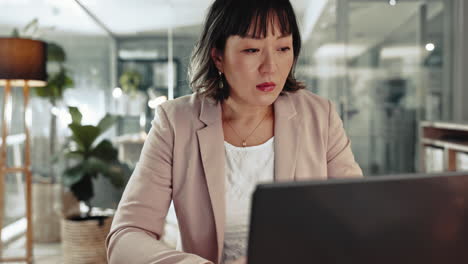 Business,-laptop-and-Asian-woman-writing-notes