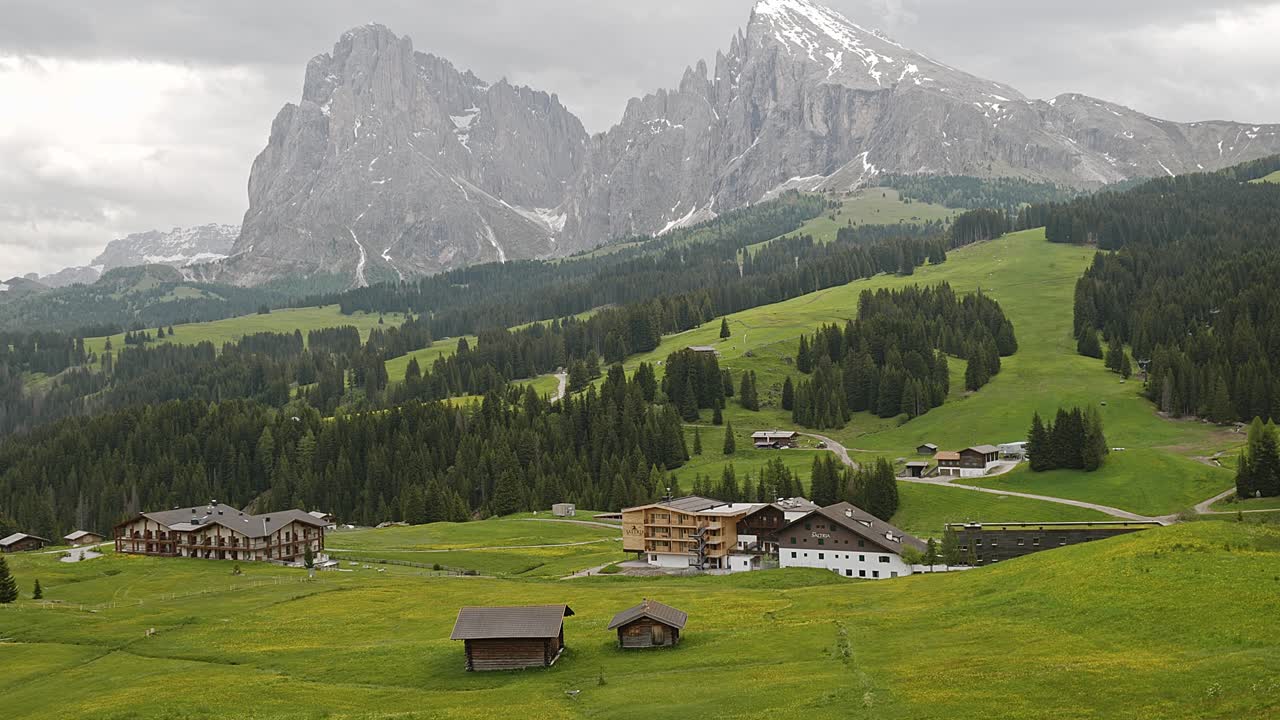Sassolungo mountain peaks from Seiser Alm Alpine meadow Dolomites