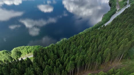 Aerial-looking-down-at-highway-E16-and-Train-to-Bergen-Norway-from-steep-mountain-with-risk-for-landslide